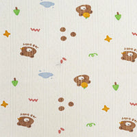 Découvrez le Tissu pointelle en coton imprimé au mètre de Longan Craft France : un tissu maille haute qualité orné d'oursons, étoiles, toupies et nuages sur fond crème, idéal pour la couture de vêtements d'enfants DIY.