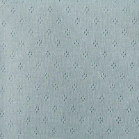 Tissu jersey pointelle 100 % coton au mètre de Longan Craft France, doux et léger avec motifs losanges. Parfait pour body bébé ou sous-vêtements DIY, il offre confort et touche décorative discrète grâce à son design jacquard.