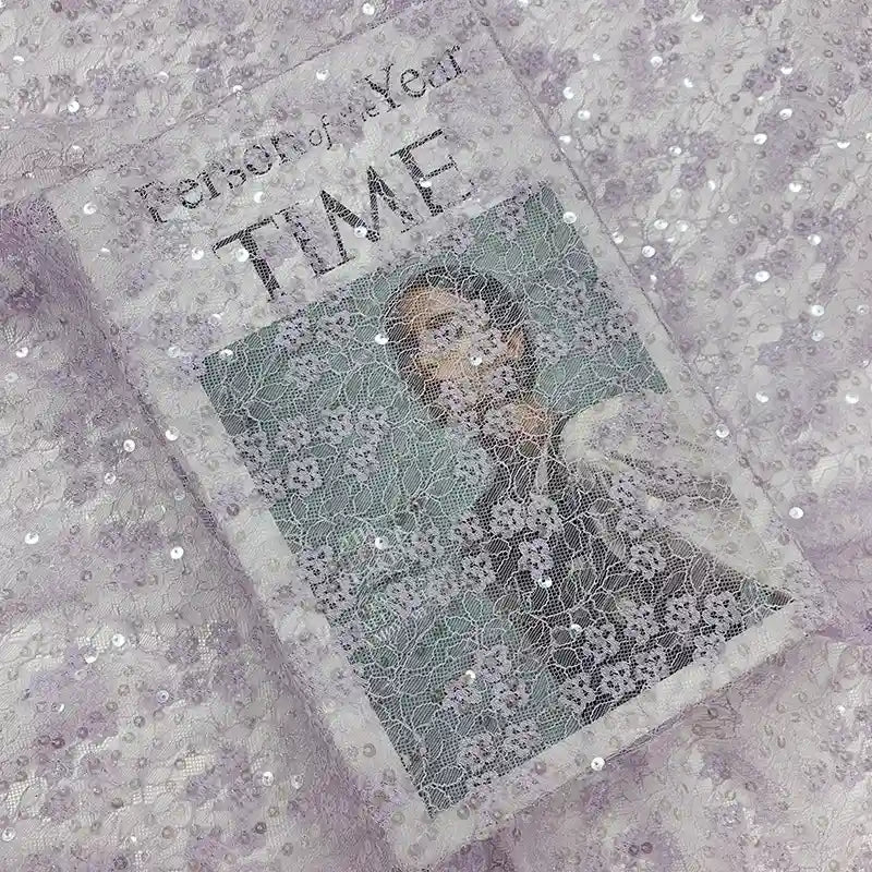 Une couverture du magazine TIME représentant une personne est élégamment recouverte du "Tissu dentelle à sequins au mètre | Dentelle pailletée pour robes de mariée" de Longan Craft France, ajoutant une texture étincelante au titre "Personne de l'année".