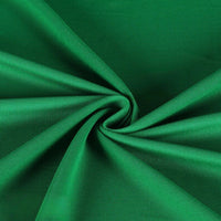 Un gros plan de Tissu piqué uni simple face au mètre de Longan Craft France montre une maille verte piqué fin d'été, proprement froncée au centre en plis souples et avec un léger motif en spirale, mettant en valeur sa texture lisse et raffinée pour les chemises à manches courtes DIY.