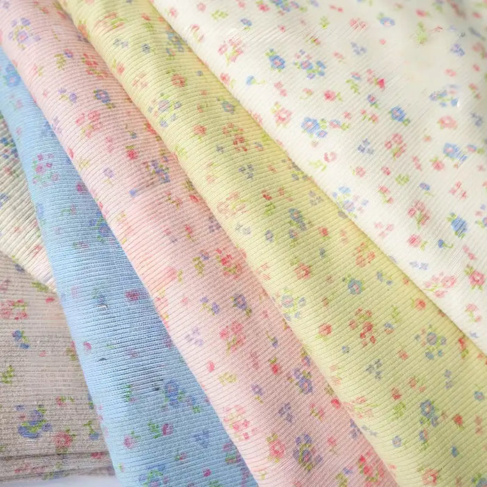 Maille côtelée en coton imprimé petites fleurs au mètre