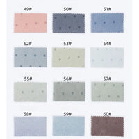 Quinze échantillons rectangulaires de Tissu en satin jacquard à petits pois de Longan Craft France, étiquetés 49#-60#, présentent des tons pastel et neutres. Ces tissus de satin multicolores présentent un subtil motif à pois et sont idéaux pour la confection de vêtements.