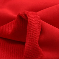 Gros plan sur le Tissu French Terry en coton uni au mètre de Longan Craft France, un tissu épais et rouge vif avec une texture tissée visible et un pli central, idéal pour la confection de sweat-shirts et de vestes à capuche.
