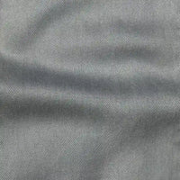 Gros plan sur Tissu en lyocell denim multicolore au mètre de Longan Craft France, montrant son tissage sergé diagonal et ses plis subtils - un denim lyocell respirant et confortable, parfait pour les jeans.