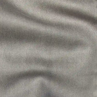 Gros plan sur Tissu en lyocell denim multicolore au mètre de Longan Craft France, montrant son tissage sergé diagonal et sa texture fine - un choix de lyocell respirant et confortable pour les jeans.