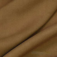 Gros plan sur le tissu lyocell et lin uni au mètre de Longan Craft France, un textile durable et respirant pour les robes. L'image montre son tissage sergé fin et ses légers plis, mettant en valeur le tissu lyocell lisse et infroissable.