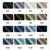 Un nuancier présente 16 échantillons de tissu sur quatre rangs, chacun étiqueté d'un numéro, présentant des nuances de Jersey modal uni au mètre de Longan Craft France-un tissu jersey coton-modal respirant, parfait pour les vêtements de nuit.