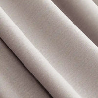 Gros plan sur le Jersey modal uni au mètre de Longan Craft France - un tissu coton-modal beige clair, lisse et respirant, aux plis doux, parfait pour les vêtements de nuit et les vêtements pour enfants.