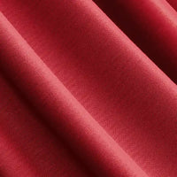 Gros plan sur le Jersey modal uni au mètre de Longan Craft France : tissu jersey coton-modal rouge avec texture visible, finition lisse et plis diagonaux. Ce textile respirant est idéal pour les vêtements de nuit.