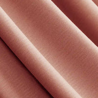 Gros plan sur le Jersey modal uni au mètre de Longan Craft France : un tissu jersey coton-modal doux et rosé, à la texture lisse et au tissage visible, parfait comme textile respirant pour la lingerie de nuit.