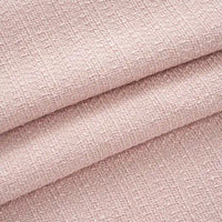 Gros plan sur le Tissu tweed uni au mètre de Longan Craft France, un tweed de polyester rose pâle à la texture subtile et à l'épaisseur visible, parfait pour les manteaux ou les costumes chics.