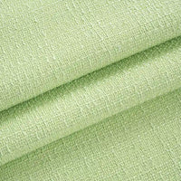 Gros plan sur le Tissu tweed uni au mètre de Longan Craft France : tweed de polyester vert clair à la surface tissée texturée, soigneusement plié pour mettre en valeur son épaisseur et son aspect chic - textile idéal pour les manteaux ou les costumes.