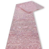 Une longueur de Tulle brodé de sequins étoiles et lunes de Longan Craft France est posée à plat, montrant ses motifs complexes d'étoiles et de lunes - un tulle parfait pour les robes avec des broderies de sequins étincelantes.