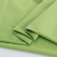 Découvrez de près le Tissu French Terry en coton extensible au mètre de Longan Craft France, tricoté multicolore et confortable, parfait pour des vêtements de sport ou des sweatshirts.