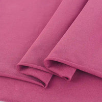 Gros plan sur le Tissu French Terry en coton extensible au mètre de Longan Craft France, montrant sa texture lisse, son tissage visible et ses bords nets - idéal pour les sweatshirts et les vêtements de sport. Multicolore tricoté et confortable.