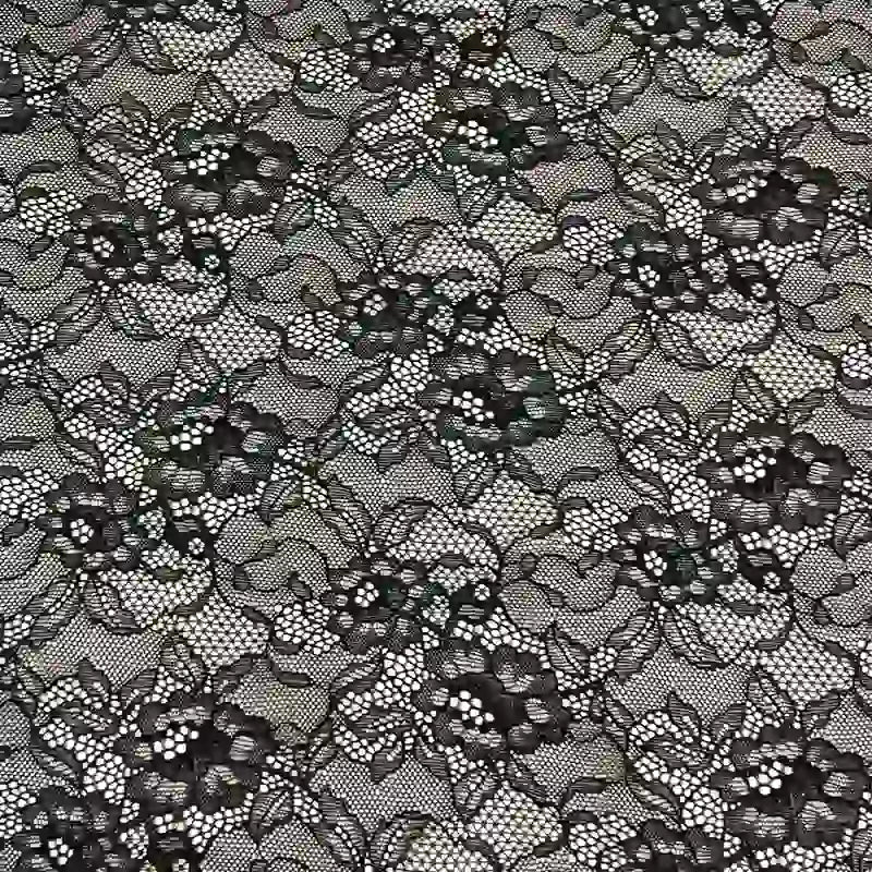 Le tissu dentelle extensible au mètre de Longan Craft France est une dentelle multicolore de haute qualité, parfaite pour vêtements, lingerie ou jupes. Son motif répète fleurs, feuilles et vignes sur un fond en maille transparente.
