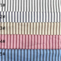 Cinq tissus "Linon de coton à fines rayures" de Longan Craft France, numérotés 1# à 5#, sont empilés, chacun avec une base colorée et des rayures fines, parfaits pour la confection de robes d'été.