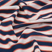 Gros plan sur le Tissu piqué de coton rayé au mètre de Longan Craft France, qui présente des rayures bleu marine, blanches et rouge-orange. Ce tissu tricolore extensible est idéal pour les t-shirts DIY et les projets de vêtements d'été.
