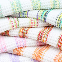 Tissu maille gaufrée rayée au mètre