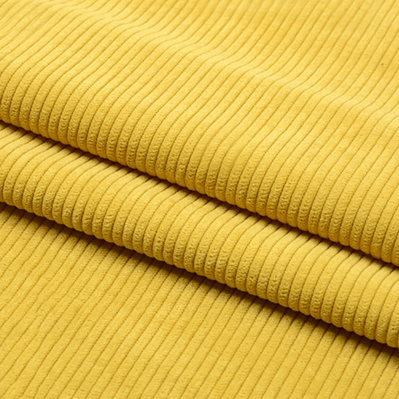 Un gros plan de Tissu velours côtelé épais 8 côtes au mètre de Longan Craft France montre son tissu jaune en polyester à stries verticales, plié en couches. Ce doux matériau est parfait pour l'ameublement et la décoration intérieure.