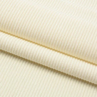 Gros plan sur le Velours côtelé coton 8 côtes uni au mètre de Longan Craft France, qui présente des teintes crème, des stries verticales et une texture douce - idéal pour le bricolage, l'habillement, les accessoires et la décoration.