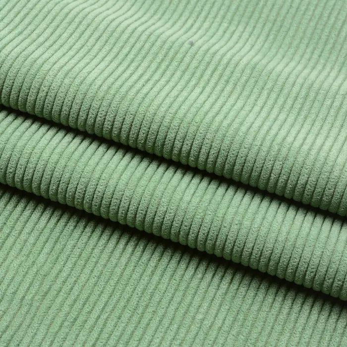 Gros plan sur le Tissu velours côtelé épais 8 côtes au mètre de Longan Craft France, plié en trois couches pour mettre en valeur sa texture douce et ses stries verticales visibles - idéal pour ajouter de la profondeur à votre décoration intérieure.