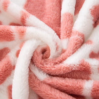 Tissu pelucheux imprimé taches de vache au mètre