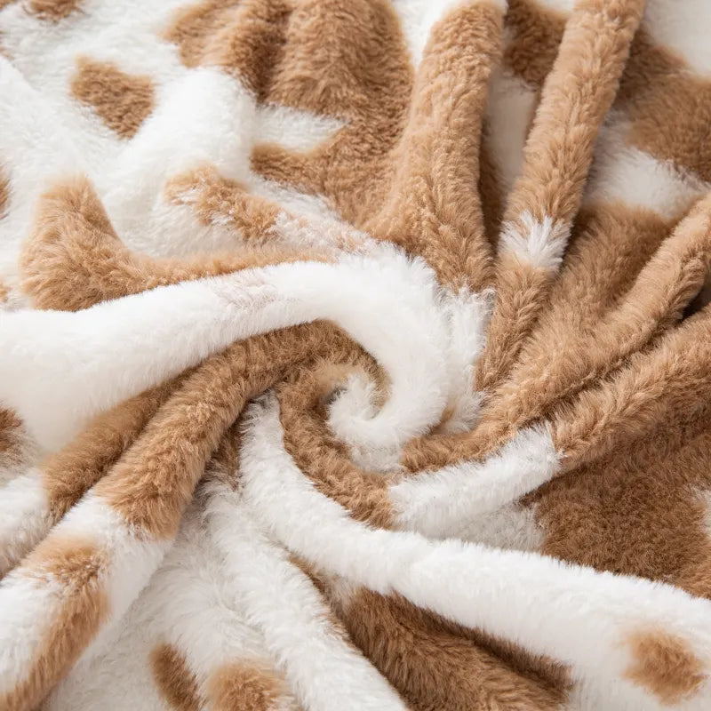 Tissu pelucheux imprimé taches de vache au mètre