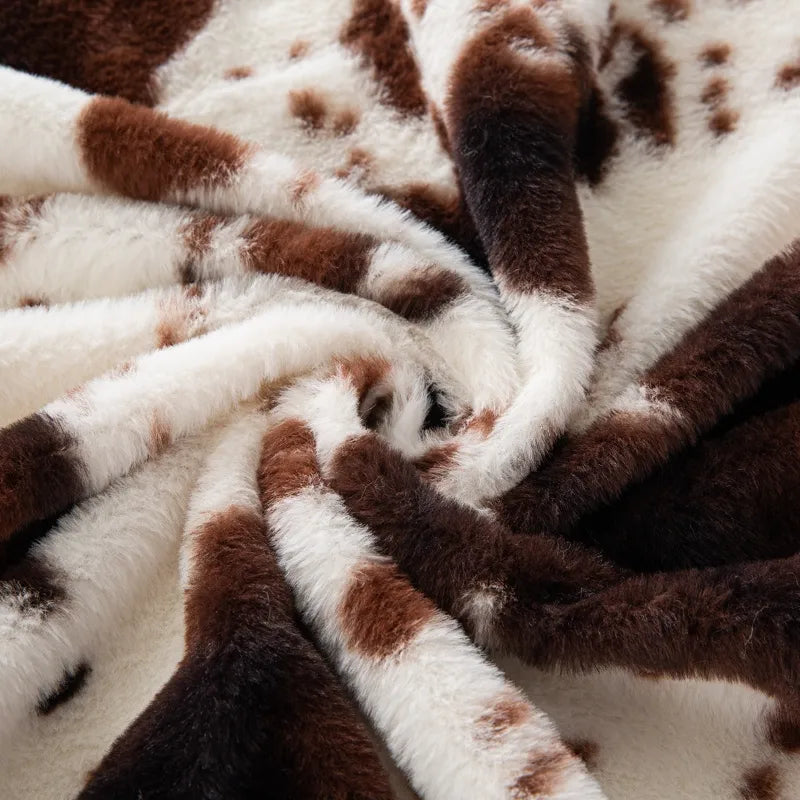 Tissu pelucheux imprimé taches de vache au mètre