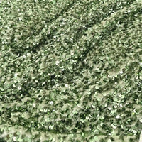 Découvrez le tissu en velours extensible à paillettes Longan Craft France : un textile scintillant, brodé de paillettes en relief, idéal pour vêtements de scène et mode grâce à sa surface brillante et texturée.