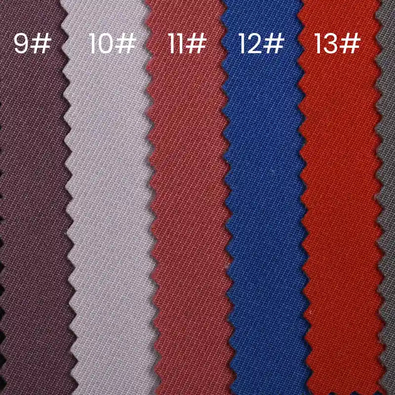 Sept échantillons de tissus verticaux (9#-13#) dans des couleurs allant du violet au gris foncé présentent le tissu gabardine imperméable au mètre de Longan Craft France, un tissu résistant à l'eau, parfait pour des vêtements de travail alliant durabilité et style.