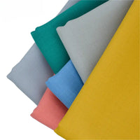 Cinq pièces de Longan Craft France Tissu gabardine de laine peignée, en gris clair, sarcelle, bleu, rose corail et jaune moutarde, sont disposées en éventail sur un fond blanc. Ce mélange durable de laine et de polyester est idéal pour les costumes sur mesure.