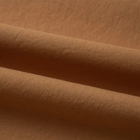 Gros plan sur le Tissu linon de coton tissé au mètre de Longan Craft France en marron clair, présentant une surface lisse et légèrement texturée - parfait comme doublure coton haute douceur pour les projets nécessitant du coton linon multicolore au mètre.