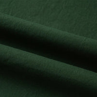 Gros plan sur le Tissu linon de coton tissé au mètre de Longan Craft France, qui présente une texture lisse avec des plis doux et des ombres légères. Ce coton linon multicolore, doublure coton haute douceur, est idéal pour des projets de couture polyvalents.
