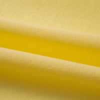 Gros plan sur le Tissu linon de coton tissé au mètre de Longan Craft France, montrant des couches superposées de coton multicolore, doux et mat, convenant à une doublure de grand confort.