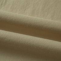Un gros plan du Tissu linon de coton tissé au mètre de Longan Craft France montre sa surface lisse et légèrement texturée avec de légers plis horizontaux - parfait pour une doublure en coton multicolore d'une grande douceur.