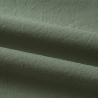 Gros plan sur le Tissu linon de coton tissé au mètre de Longan Craft France, qui présente un coton vert olive légèrement texturé avec des plis visibles, des ombres et des reflets subtils ; idéal comme doublure coton haute douceur.