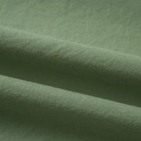 Gros plan sur le Tissu linon de coton tissé au mètre de Longan Craft France, qui présente une surface douce, légèrement texturée et des plis délicats. Cette doublure coton haute douceur est idéale pour divers projets de couture.