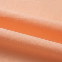 Gros plan sur Doublure coton haute douceur de Longan Craft France : light peach Tissu linon de coton tissé au mètre avec une texture lisse et délicate et des plis subtils - idéal pour ceux qui recherchent un linon de coton multicolore pour des projets raffinés.