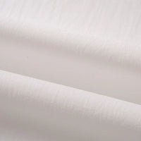 Gros plan sur le Tissu linon de coton tissé au mètre de Longan Craft France : cette doublure multicolore en coton haute douceur est légère, légèrement translucide et présente une texture douce avec une brillance subtile.