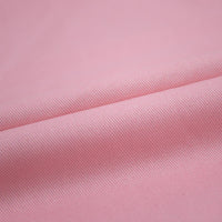 Gros plan sur le Tissu jean coloré 7,5 oz au mètre de Longan Craft France-100% coton denim sergé multicolore avec de fines nervures diagonales et des plis lisses, parfait pour les jeans colorés, les vêtements, ou la décoration.