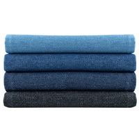 Quatre pièces pliées de Tissu denim délavé 6 oz au mètre par Longan Craft France, disposées en dégradé du bleu clair au bleu foncé et au noir, sont empilées sur un fond blanc. Denim coton doux | Tissu jean bleu.