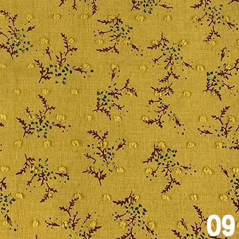 Tissu voile jacquard plumetis floral jaune par Longan Craft France, orné de petites branches rouge foncé et feuilles bleu/vertes. Numéro "09" en blanc en bas à droite. Idéal couture, vendu au mètre.