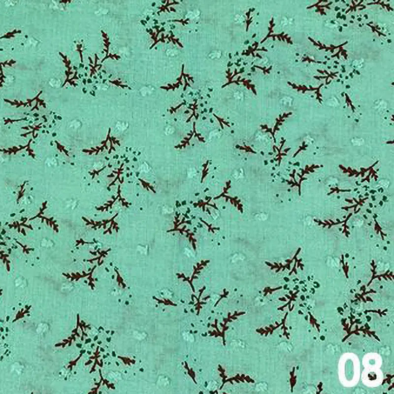 Tissu voile jacquard plumetis floral au mètre vert clair de Longan Craft France, avec de petits motifs de branches feuillues marron foncé. Le chiffre 08 apparaît en blanc dans le coin inférieur droit.