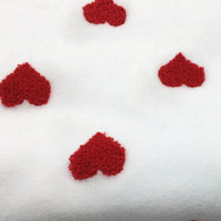 Tissu polaire à motifs cœurs au mètre