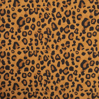 Gros plan sur la Flanelle de coton léopard au mètre de Longon Craft France : tissu flanelle audacieux et confortable, parfait pour robes, blouses et chemises avec motif animalier noir sur fond doré-brun.