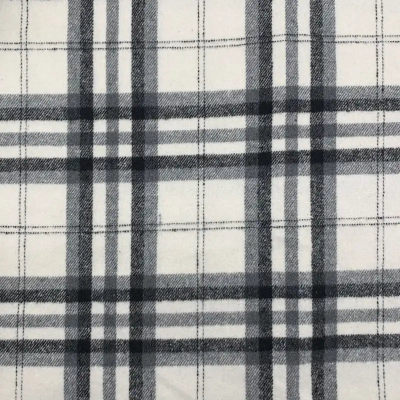 Découvrez le tissu en flanelle à carreaux noir et gris sur fond blanc de Longon Craft France, idéal au mètre pour des vêtements d'automne confortables : robes, chemises et projets couture en polyester-coton.