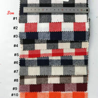 Dix échantillons de tissu flanelle à carreaux Longon Craft France, colorés et doux, sont alignés près d'une règle de 3 cm-parfaits pour projets de couture ou textile d'ameublement pendant les fêtes.