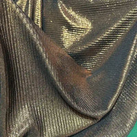 Découvrez Tissu lamé plissé au mètre de Longan Craft France-un tissu polyester extensible à effet métallique or et bronze, parfait pour couture, robes DIY ou artisanat. Sa texture plissée et brillante capte la lumière pour une allure élégante.