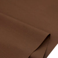 Gros plan sur la popeline polyester-coton au mètre de Longan Craft France, soigneusement pliée pour montrer sa texture lisse et régulière - parfaite pour les peignoirs, les chemises, les couches ou la décoration intérieure.